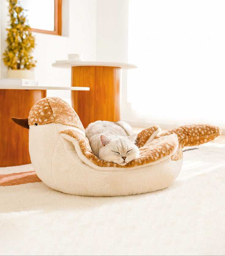 Cat peacefully napping in the Sparrow Cat Bed with cozy bird design. Ideal for pet owners seeking stylish cat furniture.