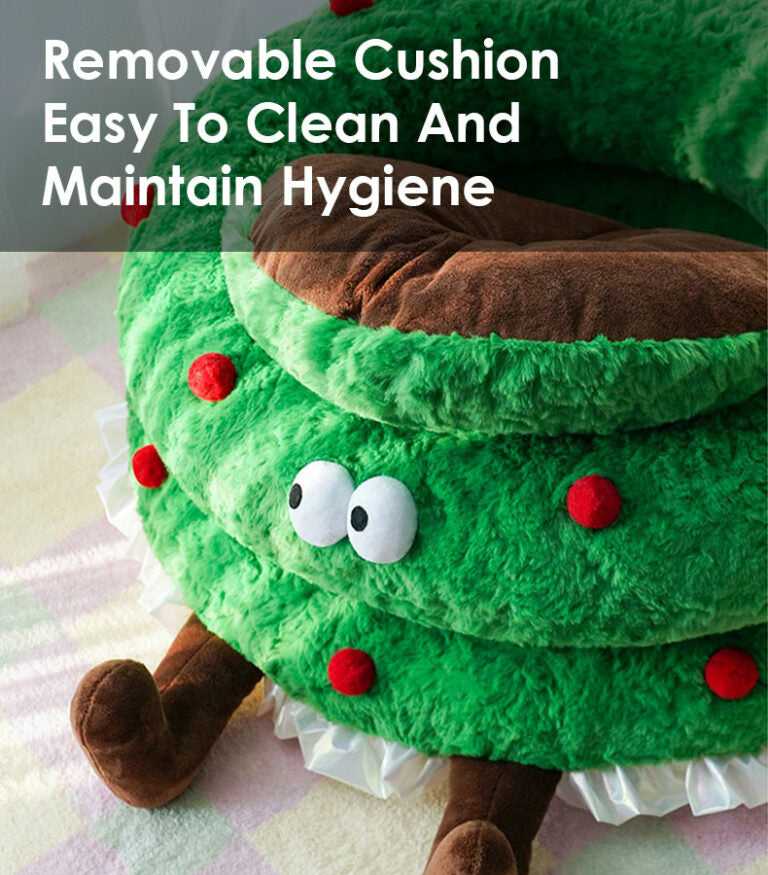 Close-up of Christmas Wreath Shaped Cat Bed with brown cushion and text 'Removable Cushion Easy To Clean And Maintain Hygiene'.