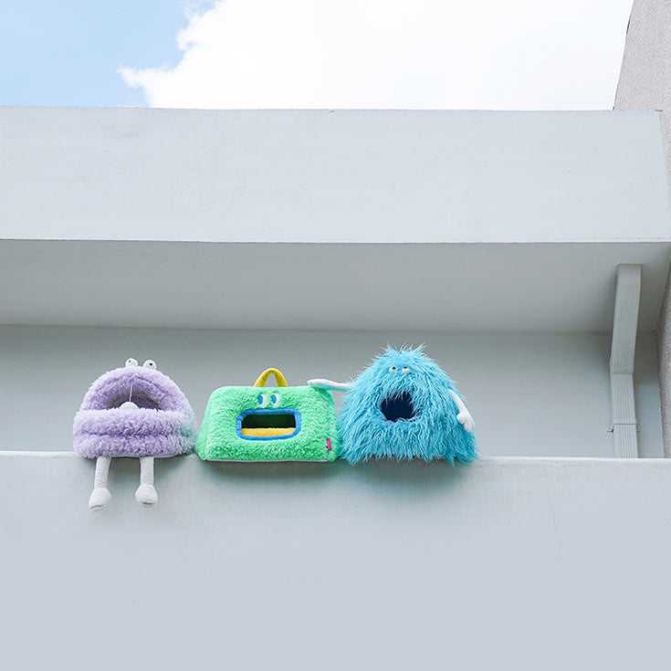 Three Monster Series Cat Beds in quirky monster shapes displayed on a white ledge, showcasing colorful and fun cat furniture options.