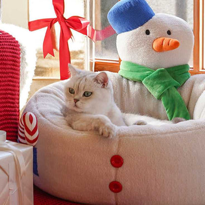 Close-up of cat relaxing in Hug Snowman Cat Bed with soft snowman headrest and red holiday accents for seasonal pet comfort.