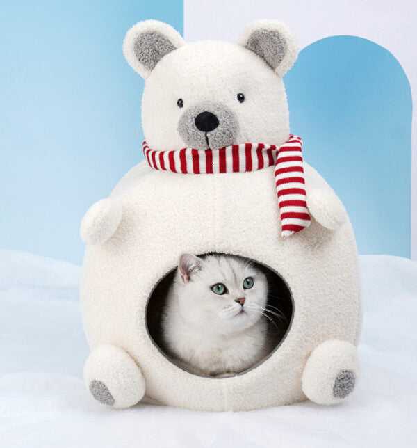 Indoor cat resting inside Polar Bear Cat Bed - Cozy Winter Retreat, shaped like a bear with soft velvet and a red striped scarf.