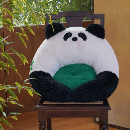 Panda Hug Cat Bed placed on a wooden chair, showcasing its round panda design with green inner cushion for stylish cat comfort.
