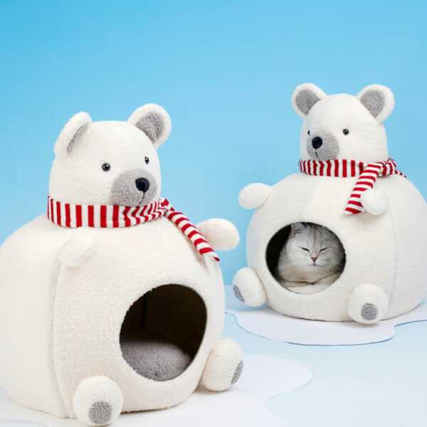 Polar Bear Cat Bed - Cozy Winter Retreat for indoor cats, featuring plush velvet and foam for warmth. Cute polar bear design with red scarf.