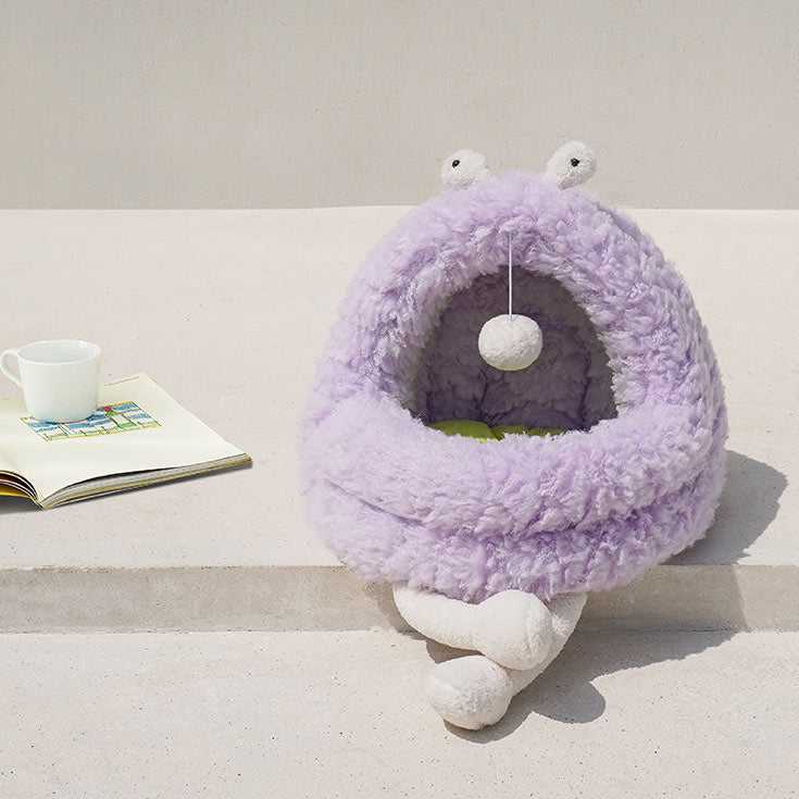 Purple Monster Series Cat Bed with plush legs and hanging toy placed on a white surface, ideal for indoor cat play and rest.