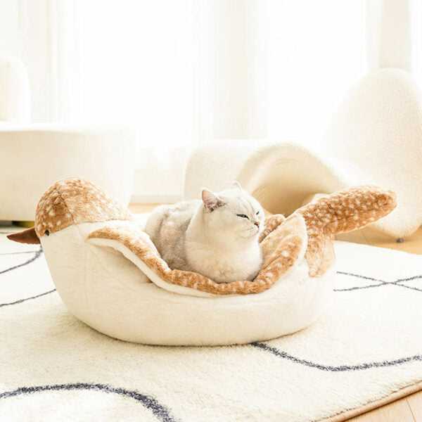 Cat relaxing in the Sparrow Cat Bed with bird-inspired design. Soft and inviting cat furniture for stylish homes.