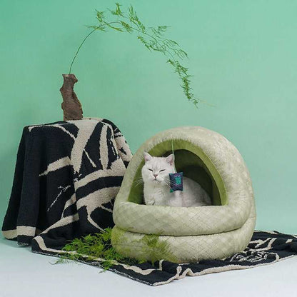Relaxed cat in Green Pine Cave Cat Bed - Japanese Design, surrounded by minimalist decor for stylish pet comfort.