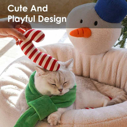 Cat enjoying candy cane toy in Hug Snowman Cat Bed with text 'Cute And Playful Design', highlighting fun holiday pet furniture.