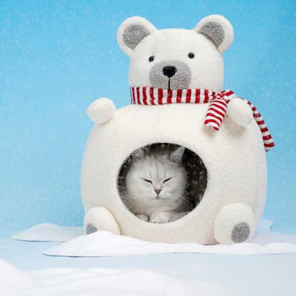 Cat enjoying warmth inside Polar Bear Cat Bed - Cozy Winter Retreat, designed for indoor cats with plush velvet and foam insulation.